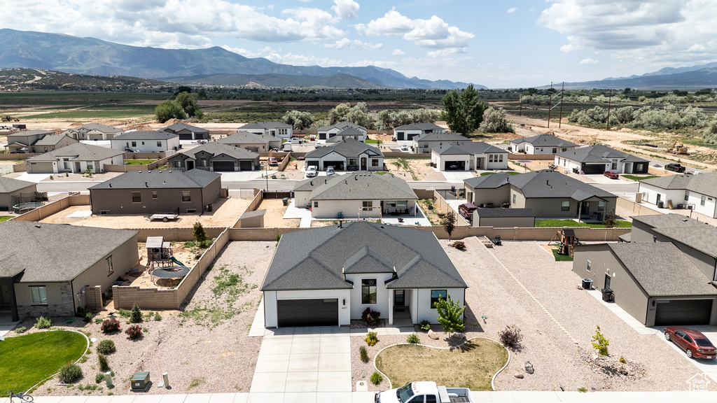 Aerial view of residential area featuring a mountain backdrop