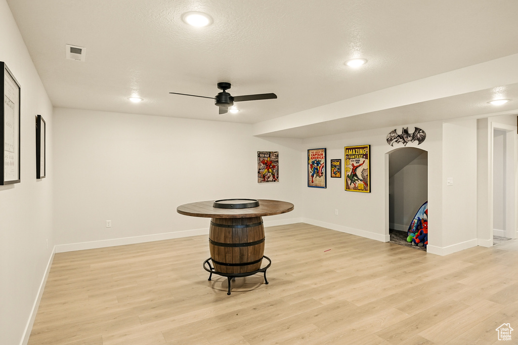 Bar area with light wood-style flooring, a ceiling fan, baseboards, and recessed lighting
