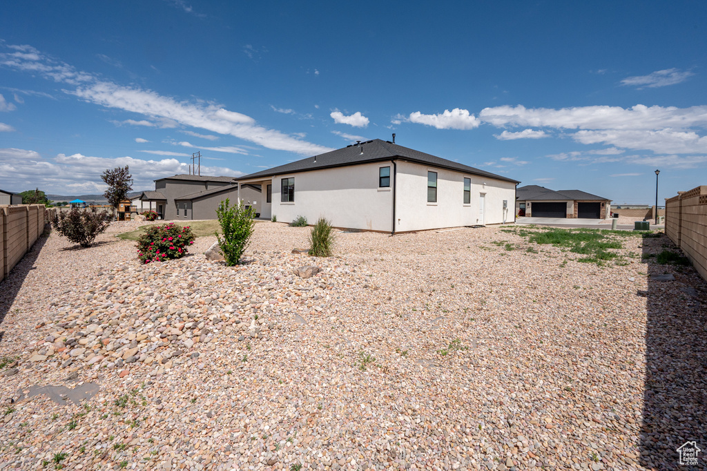 Back of house with stucco siding