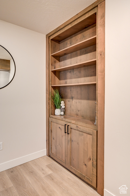 Detailed view of wood finished floors and baseboards