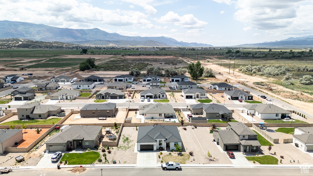 Aerial view of residential area with a mountainous background