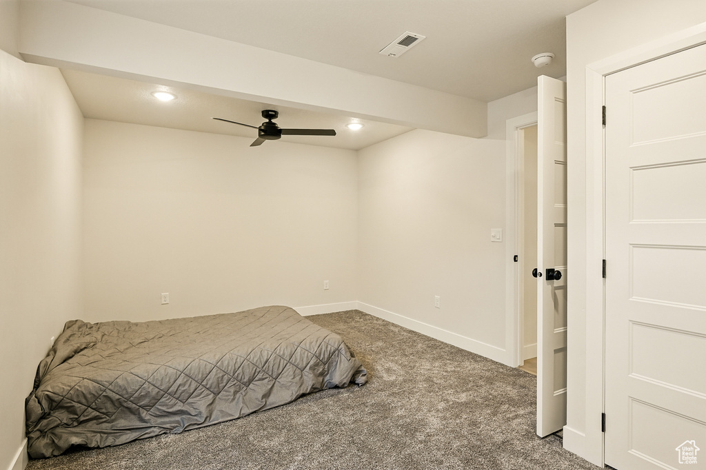 Carpeted bedroom featuring recessed lighting, baseboards, and ceiling fan