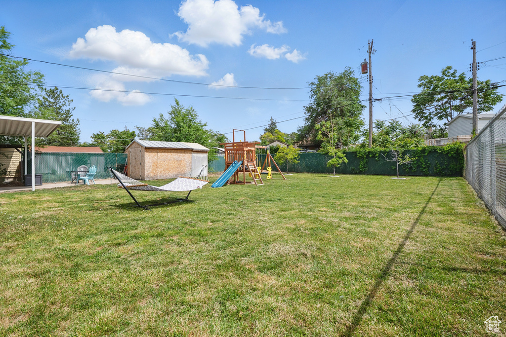 View of yard featuring a playground