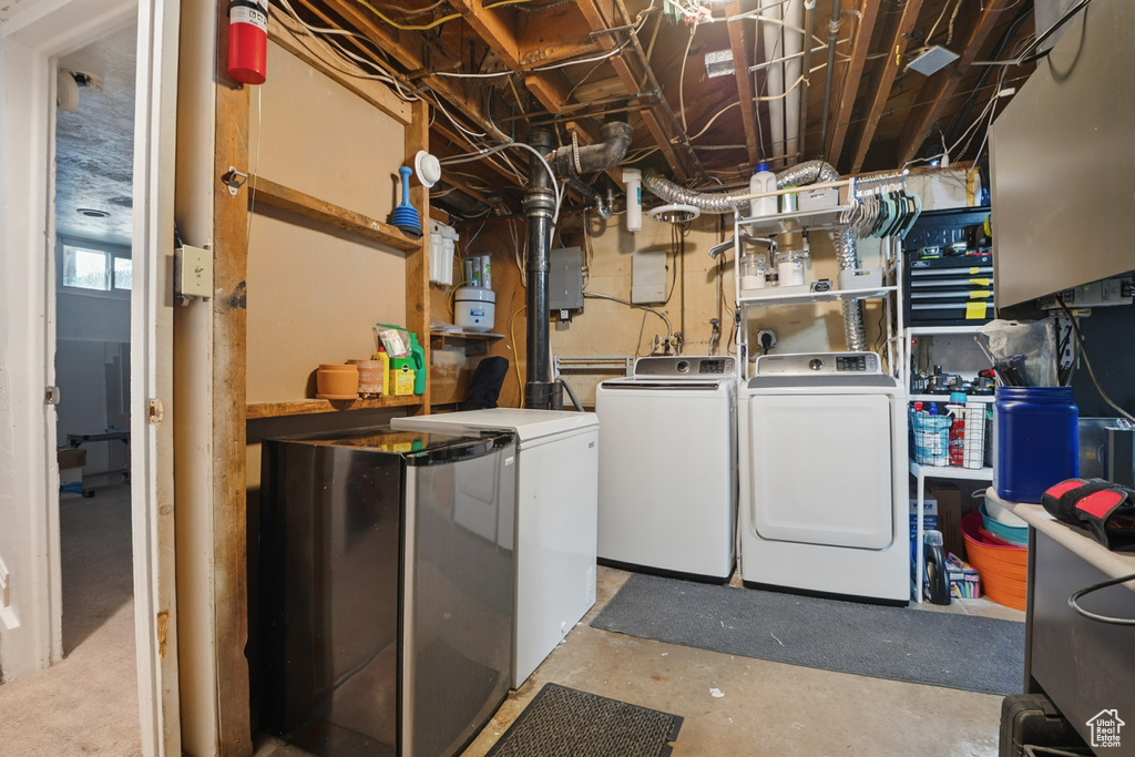 Washroom featuring independent washer and dryer