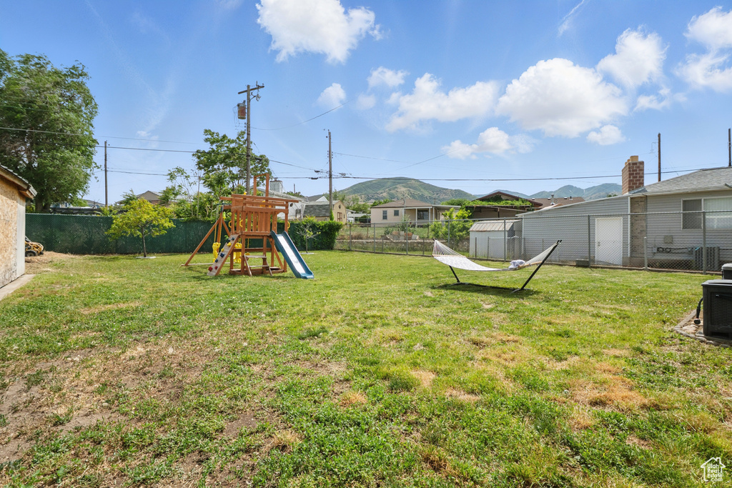 View of yard featuring a playground