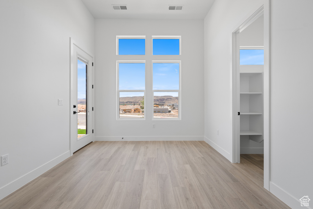 Unfurnished bedroom with light wood-type flooring and baseboards