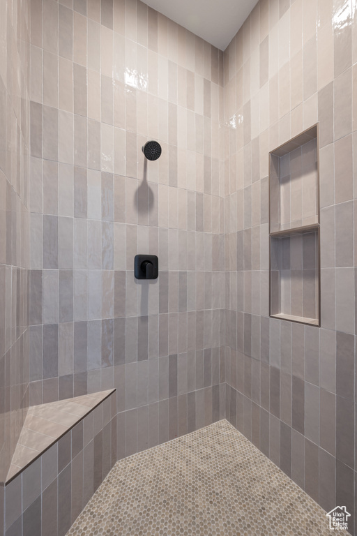 Bathroom featuring tiled shower