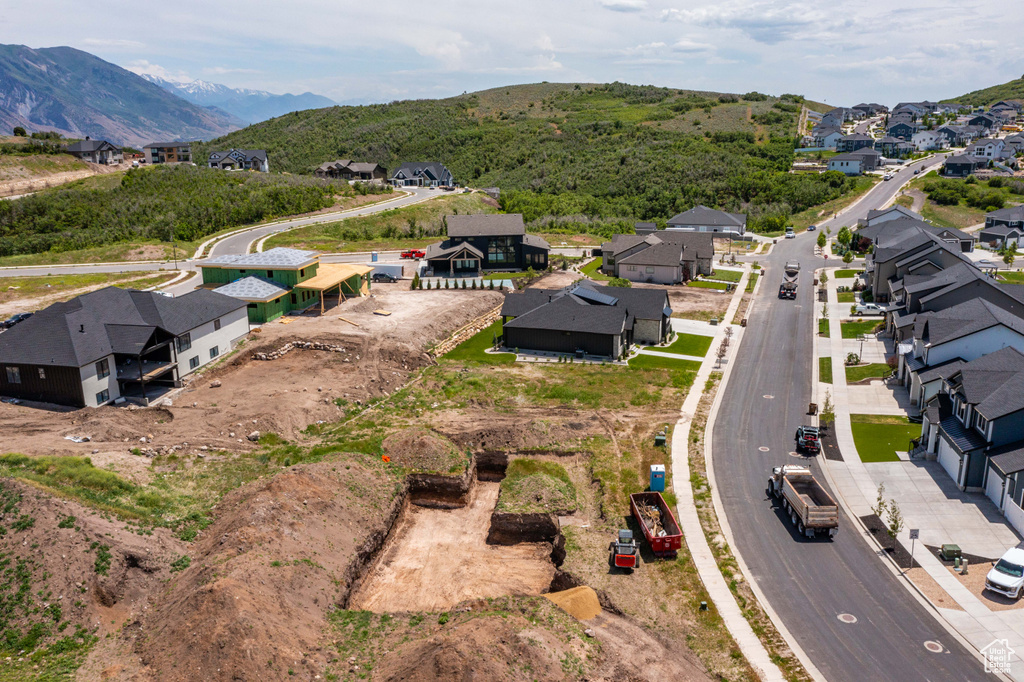 Aerial view of residential area featuring a mountain backdrop