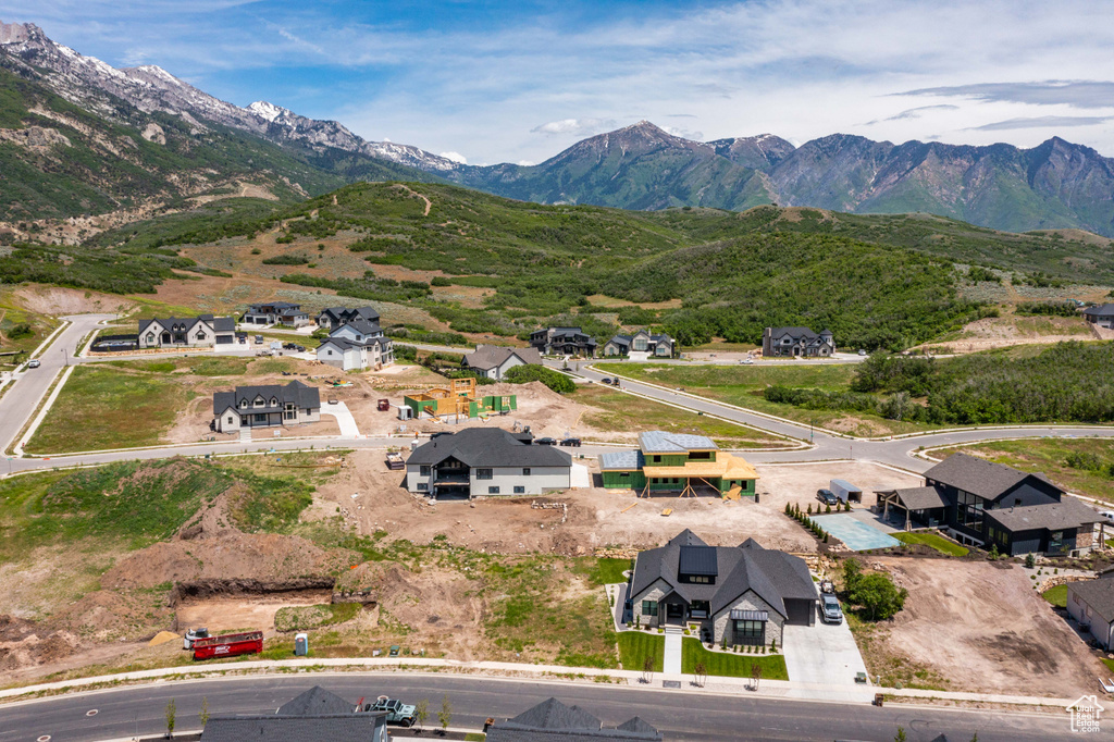 Aerial perspective of suburban area featuring a mountain backdrop
