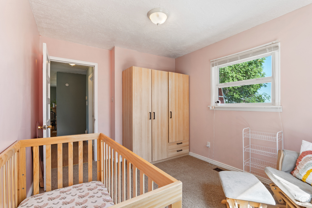 Bedroom with carpet and baseboards