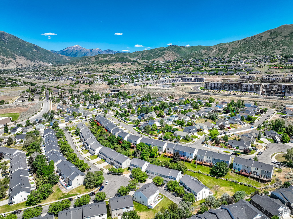 Aerial overview of property\\\'s location featuring nearby suburban area and mountains