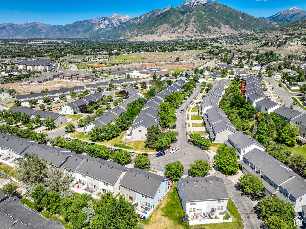 Aerial view of residential area featuring a mountain backdrop