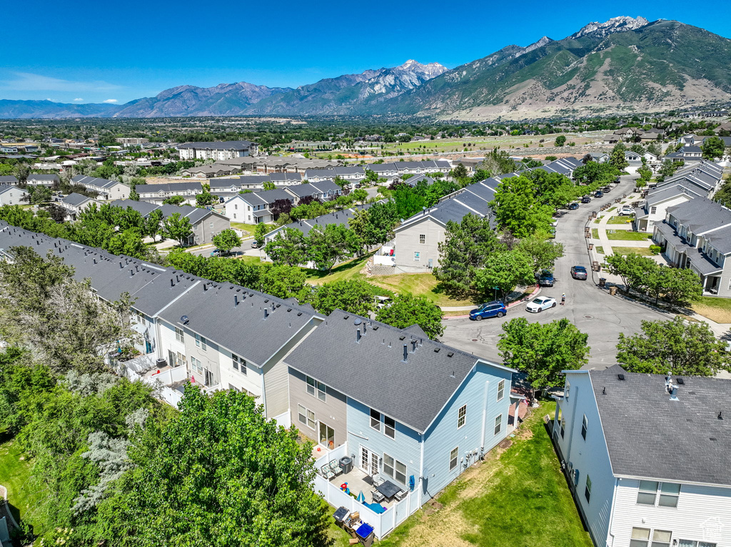 Aerial perspective of suburban area with a mountainous background