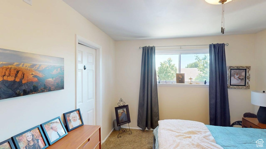 Bedroom with carpet and baseboards