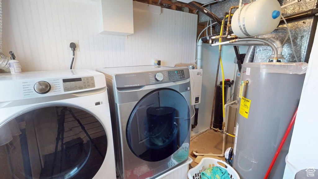 Laundry room with separate washer and dryer and water heater
