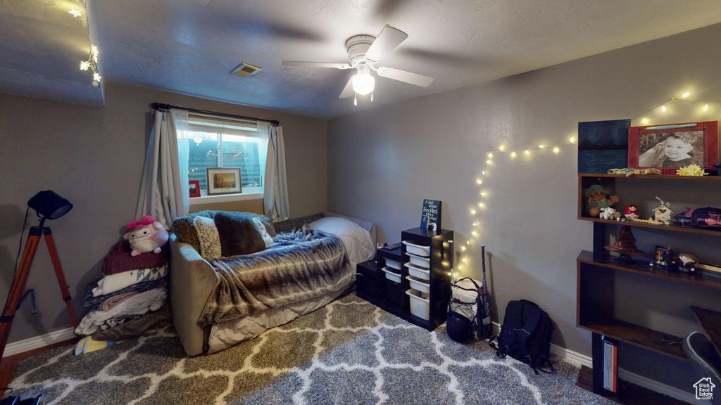 Bedroom featuring baseboards and a ceiling fan