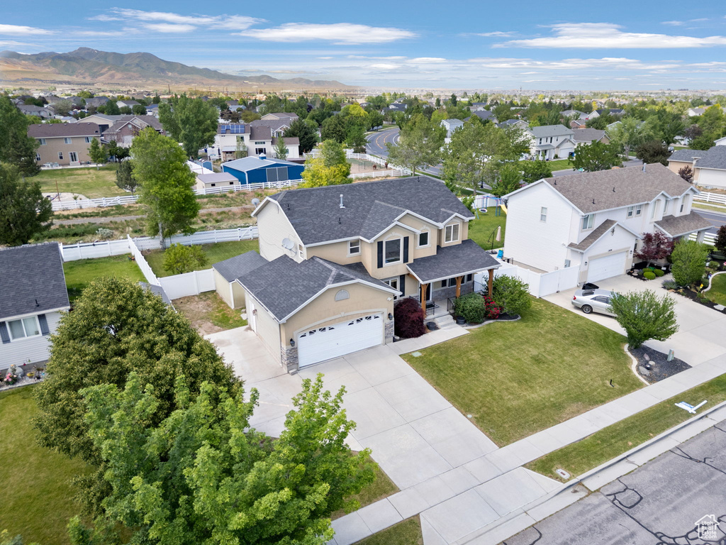 Aerial perspective of suburban area with a mountain backdrop