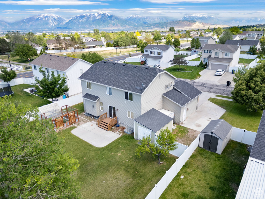 Aerial perspective of suburban area featuring mountains