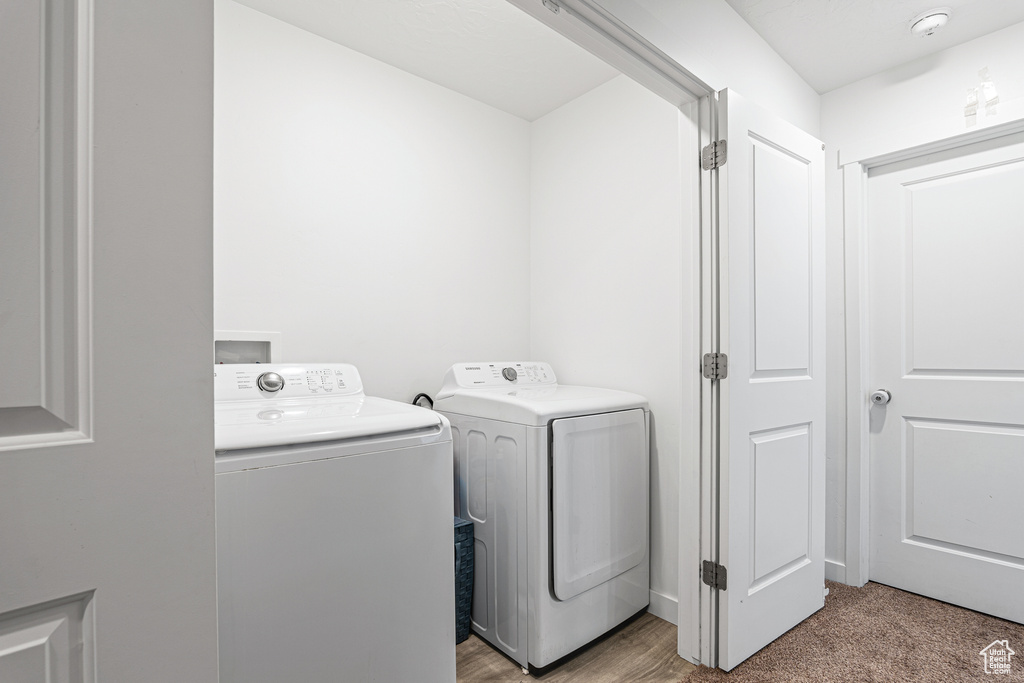 Laundry area with washer and clothes dryer