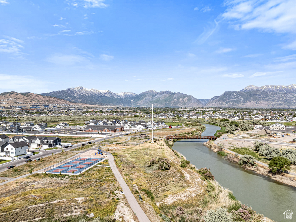 View of mountain backdrop with a large body of water and nearby suburban area