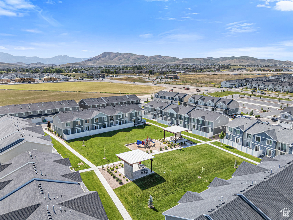 Aerial view of residential area featuring a mountain backdrop