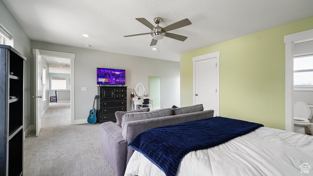 Carpeted bedroom featuring recessed lighting, baseboards, and a ceiling fan