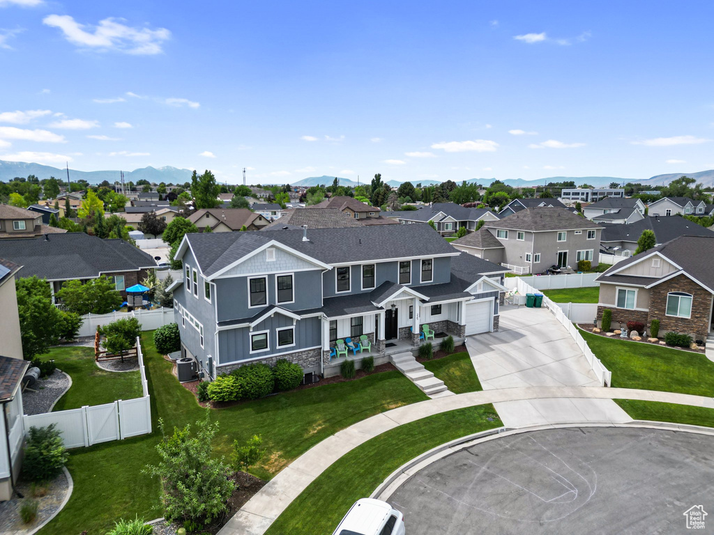 Aerial perspective of suburban area with a mountain backdrop