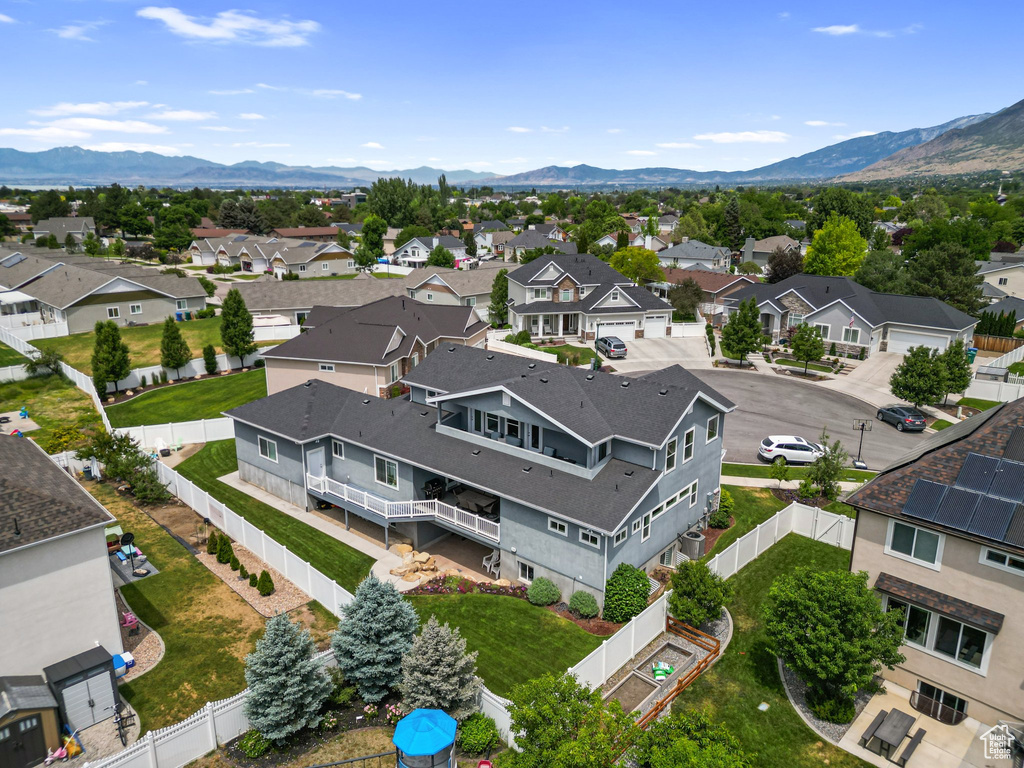 Aerial perspective of suburban area with a mountainous background
