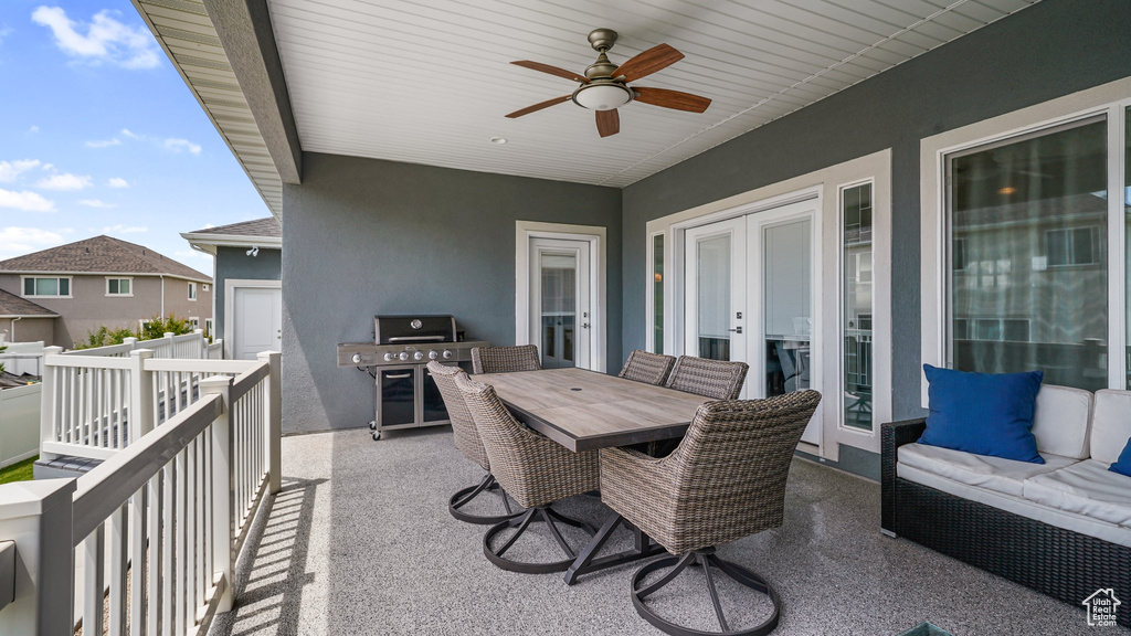 View of patio with french doors, an outdoor living space, a ceiling fan, and outdoor dining space