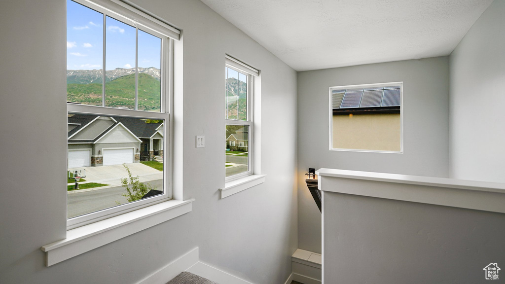 Doorway featuring baseboards and a mountain view