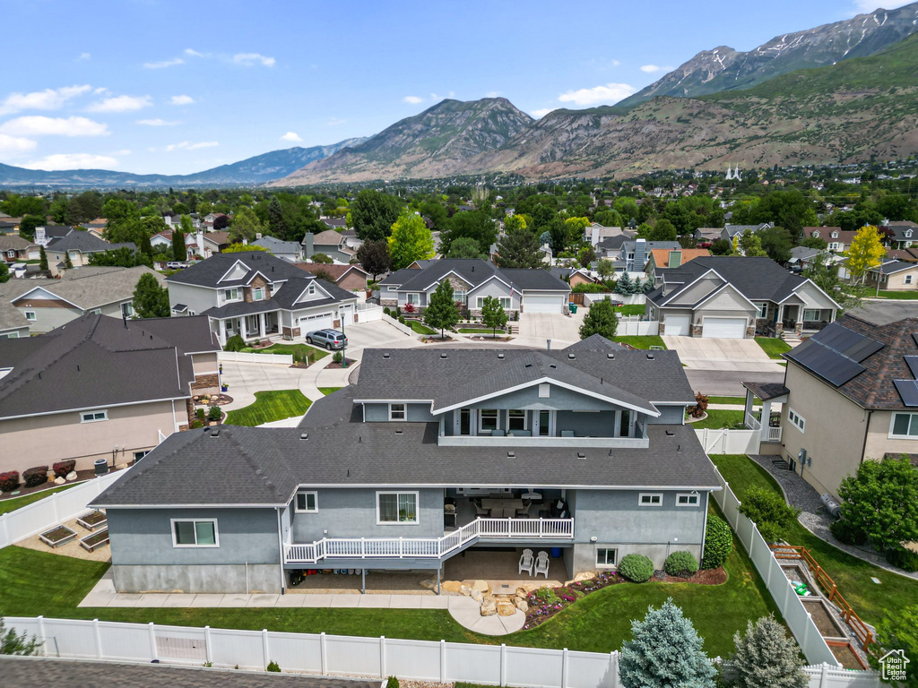 Aerial perspective of suburban area with a mountain backdrop