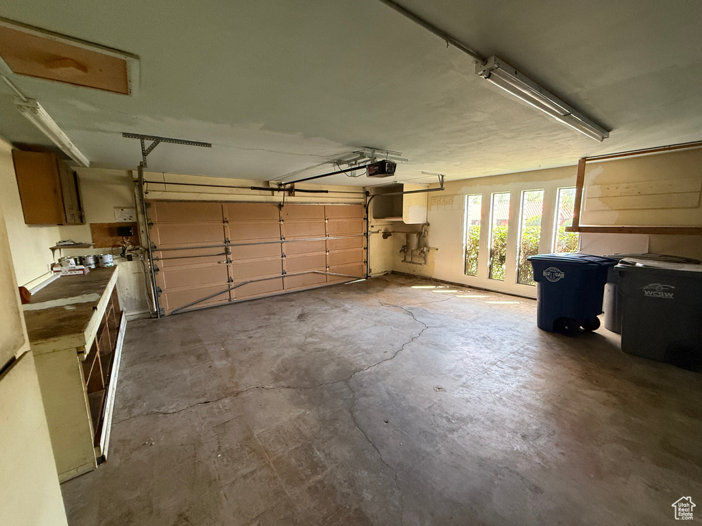 Garage featuring a garage door opener