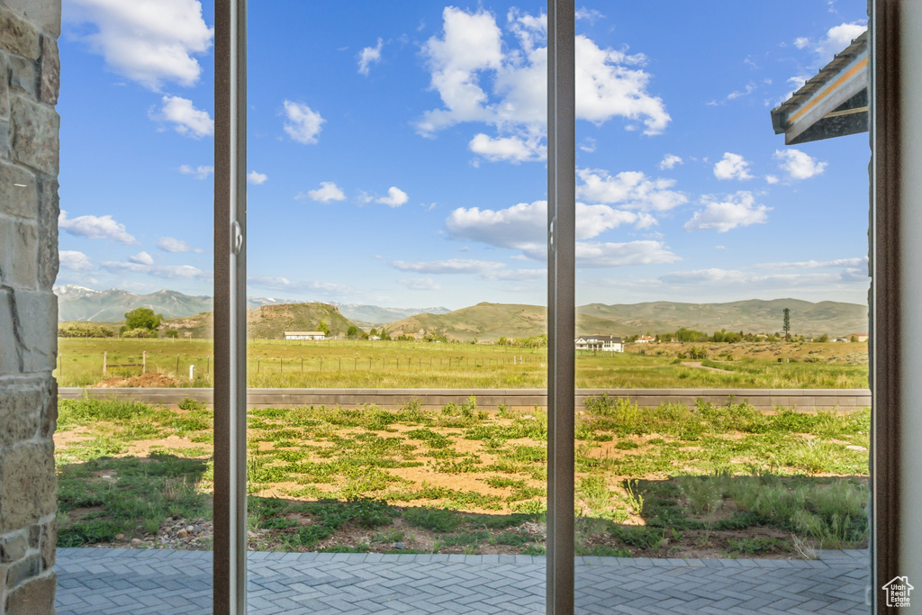Doorway to outside with a mountain view and a view of countryside