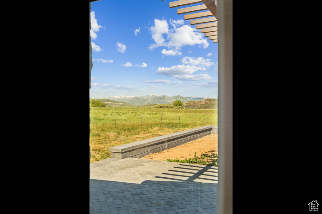 Entryway with a mountain view and a view of rural / pastoral area