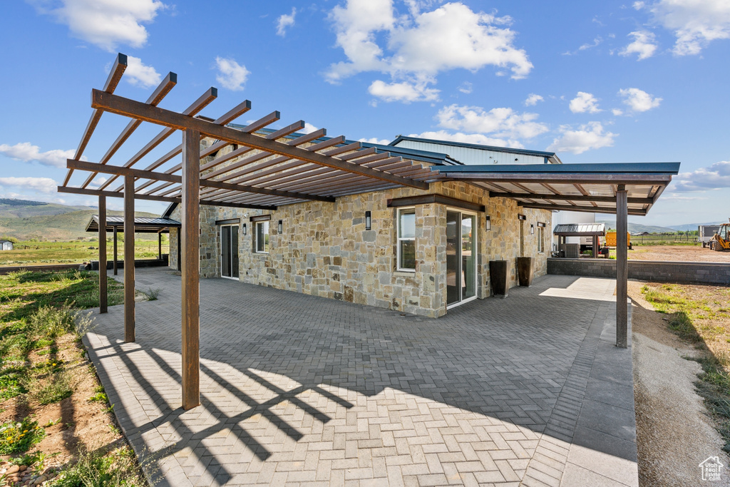 View of patio with a pergola