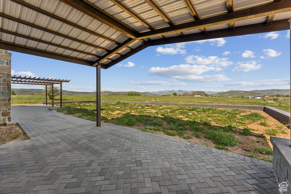 View of patio / terrace with a mountain view