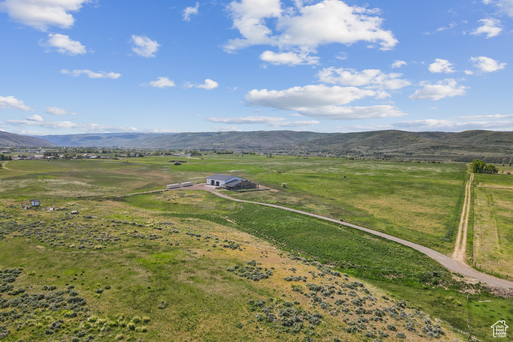Aerial view of sparsely populated area with a mountain backdrop