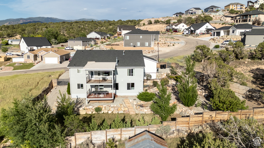 Aerial view of residential area with a mountainous background