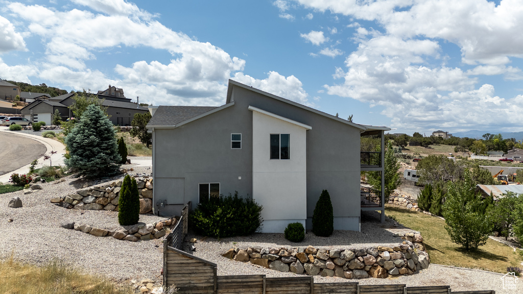 View of home\\\\\\\'s exterior featuring stucco siding and a residential view