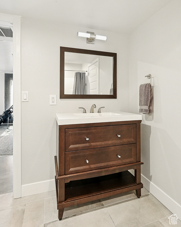 Bathroom with baseboards and vanity