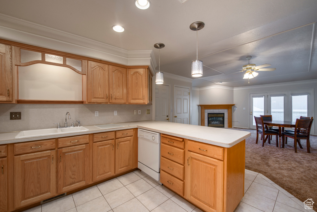 Kitchen with dishwasher, a sink, light carpet, a peninsula, and a ceiling fan
