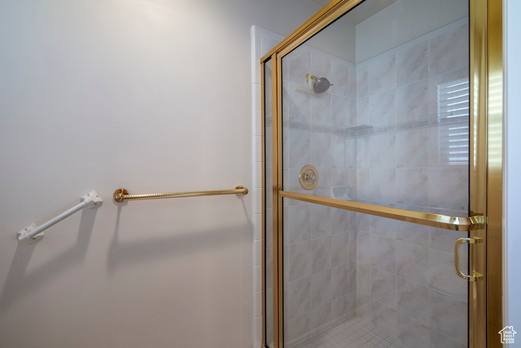 Bathroom featuring a shower stall