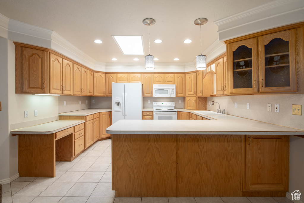 Kitchen with white appliances, a sink, glass insert cabinets, a peninsula, and light countertops