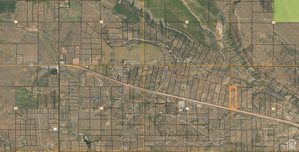 Aerial overview of property's location featuring property boundaries highlighted