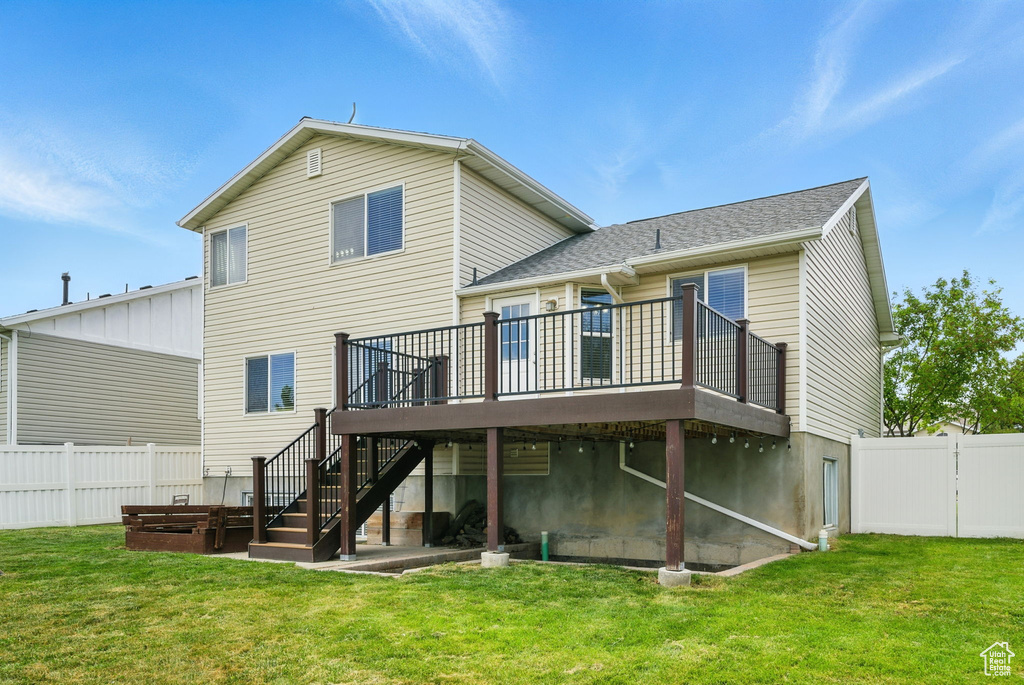 Back of house featuring a deck and stairway