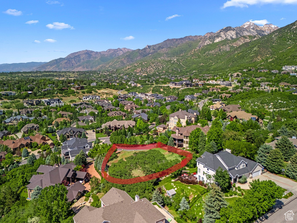 Aerial view of residential area with a mountainous background
