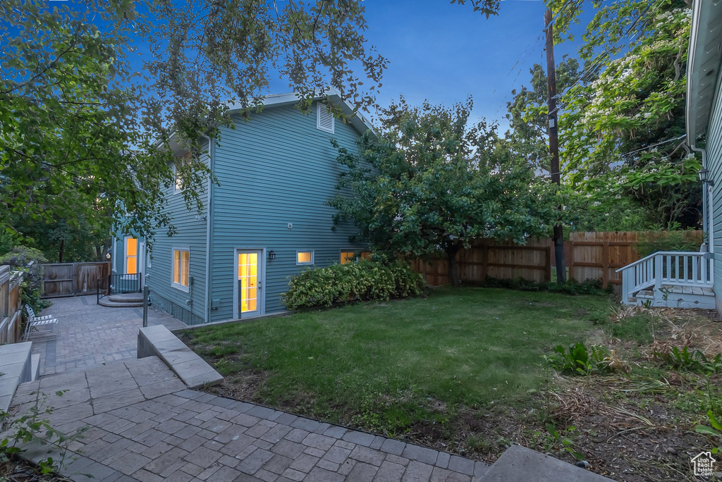 View of side of property with a patio area
