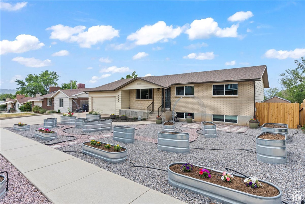 Single story home featuring brick siding