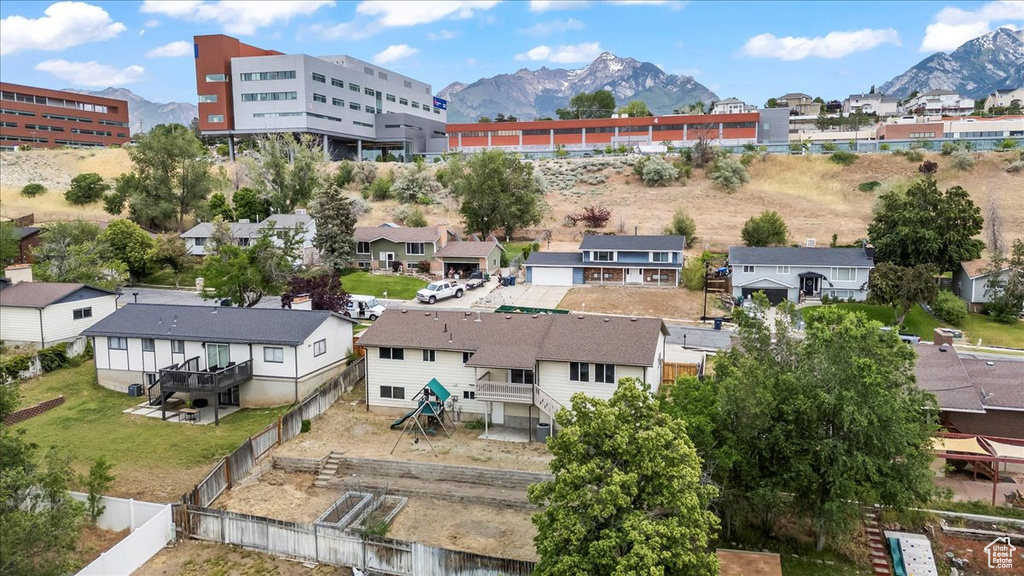 Aerial perspective of suburban area featuring a mountain backdrop