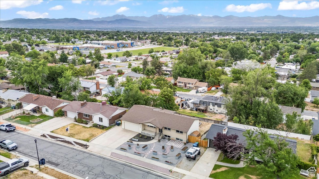 Aerial perspective of suburban area featuring a mountain backdrop
